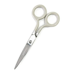 A small stainless steel scissors with ivory handles.